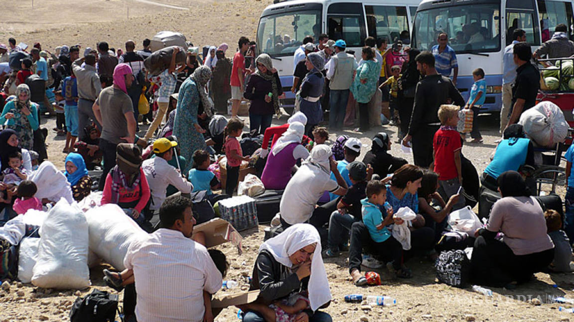 Acuerdan Alemania y Turquía enfrentar crisis de refugiados