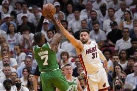 Miami Heat guard Max Strus (31) defends Boston Celtics guard Jaylen Brown (7) during the first half of Game 1 of an NBA basketball Eastern Conference finals playoff series, Tuesday, May 17, 2022, in Miami. (AP Photo/Lynne Sladky)