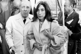 Argentine writer Jorge Luis Borges, accompanied by his secretary Maria Kodama, is seen on arrival in Madrid on Sunday, April 20, 1980 to receive the Spanish literary prize Miguel de Cervantes, he was awarded recently. (AP Photo)