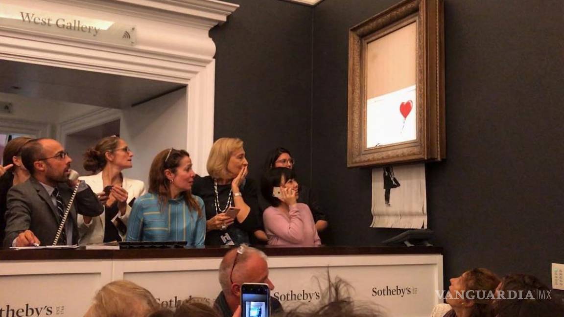 La última provocación de Banksy: obra se autodestruye tras venderse por 1.18 millones de euros en una subasta