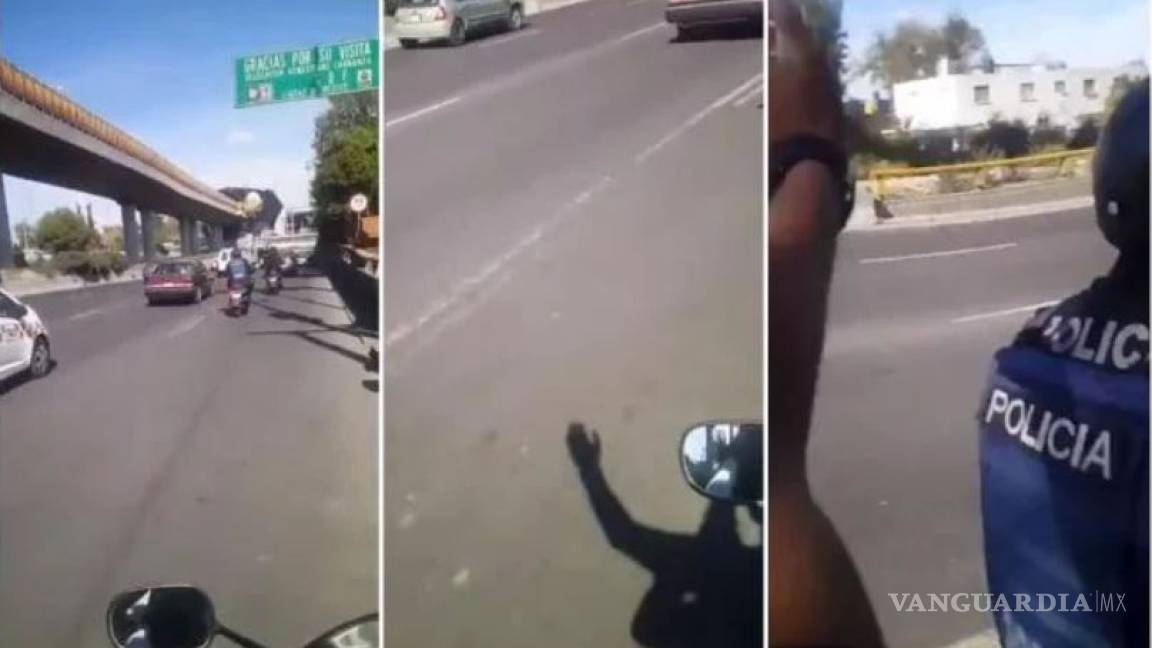 El momento en que motociclista da &quot;zape&quot; a dos policías en la Ciudad de México