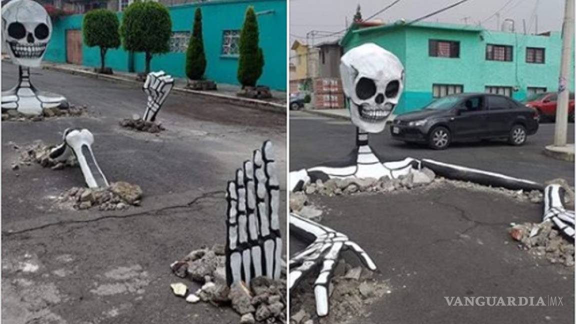 Aprovechan baches en calle de CDMX para colocar esqueletos gigantes y celebrar el Día de Muertos