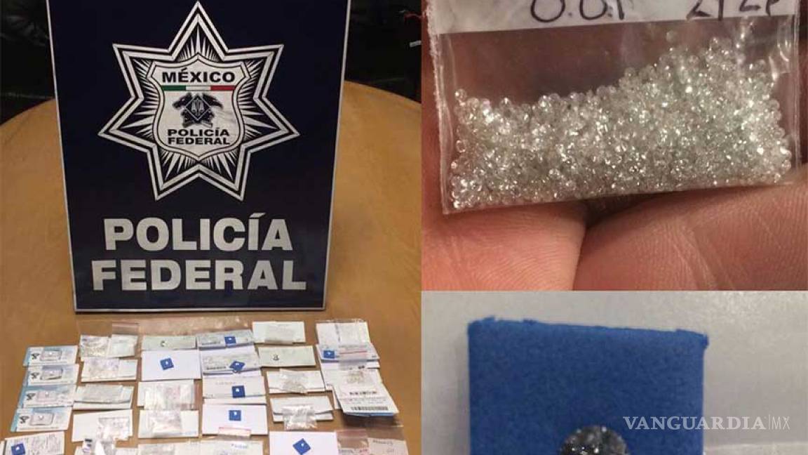 Detienen a español en el AICM con once mil 500 diamantes