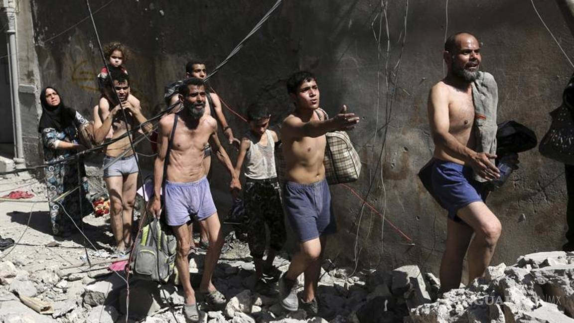 $!Civiles huyen semidesnudos de Mosul