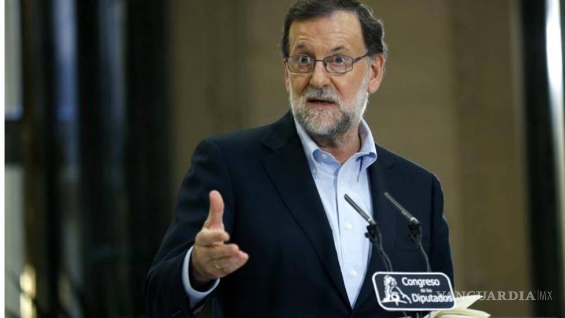 Rajoy firma acuerdo para intentar formar gobierno en España