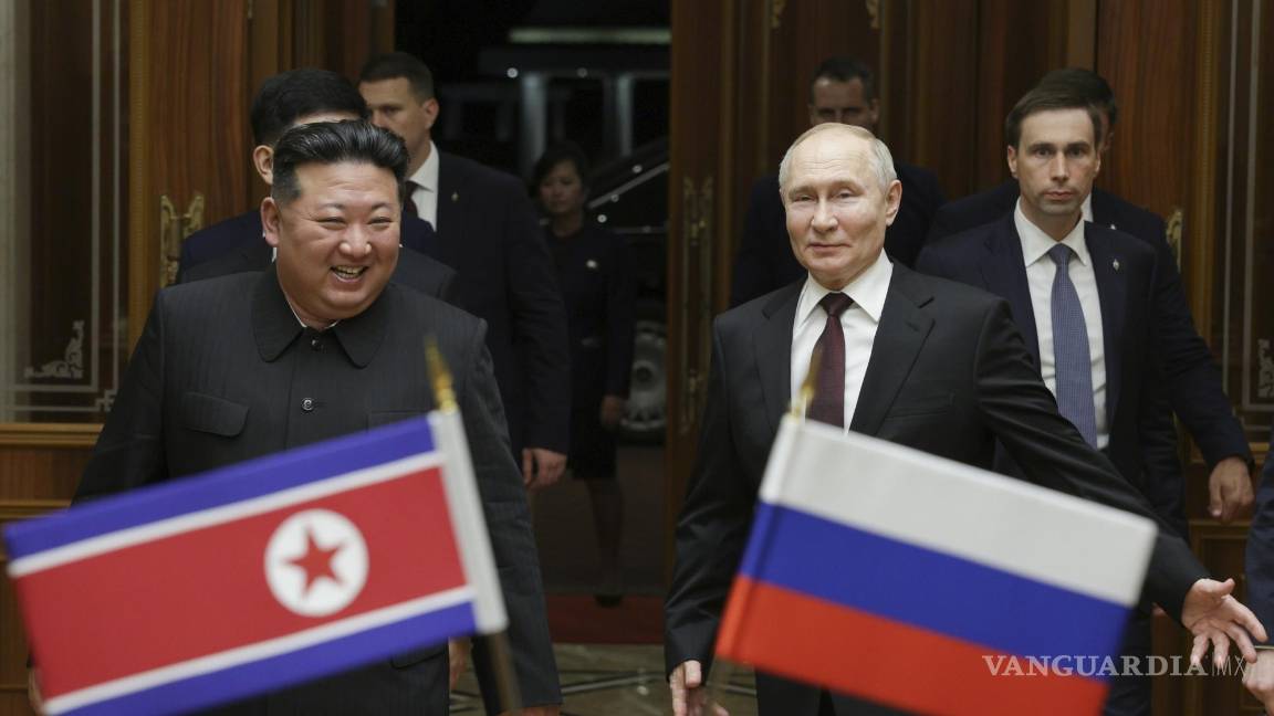 $!FILE - Russian President Vladimir Putin, right, and North Korea's leader Kim Jong Un smile during their meeting at the Pyongyang Sunan International Airport outside Pyongyang, North Korea, on June 19, 2024. (Gavriil Grigorov, Sputnik, Kremlin Pool Photo via AP, File)