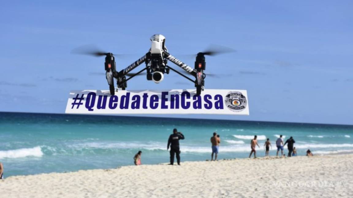 Coronavirus: Con drones, 'corren' de las playas a turistas en Quintana Roo