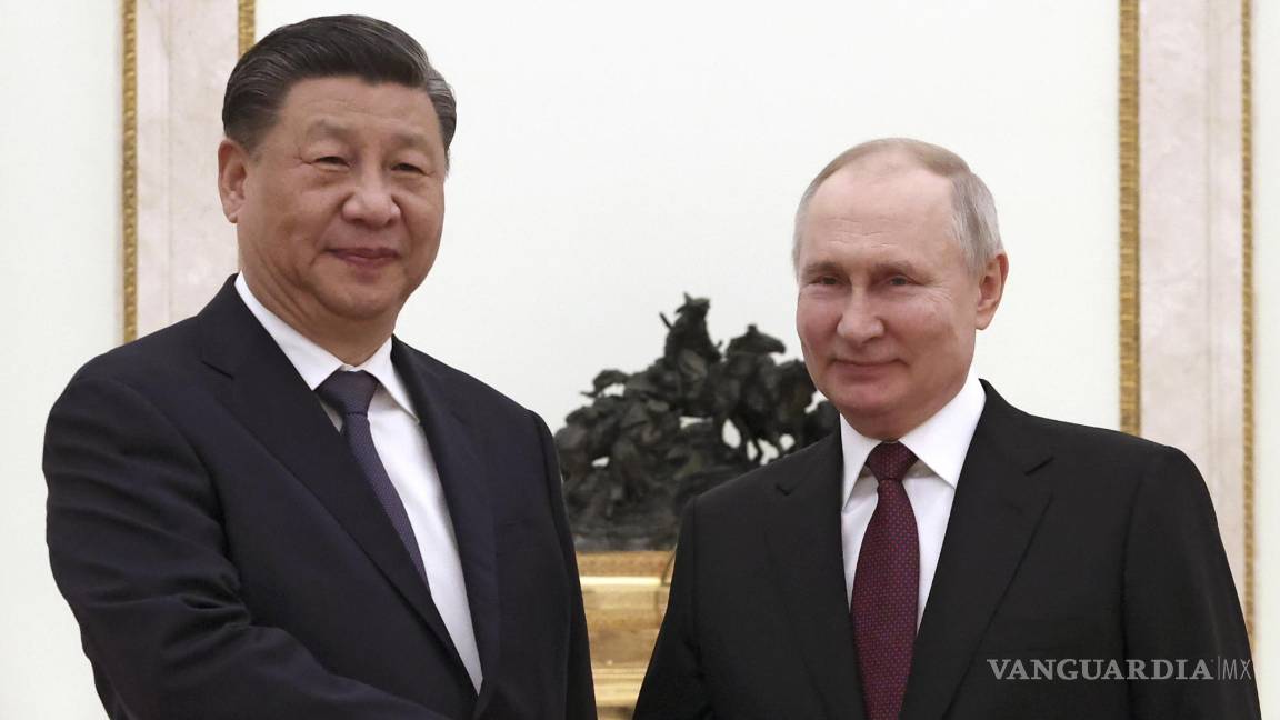 $!Saludo entre Xi y Putin.