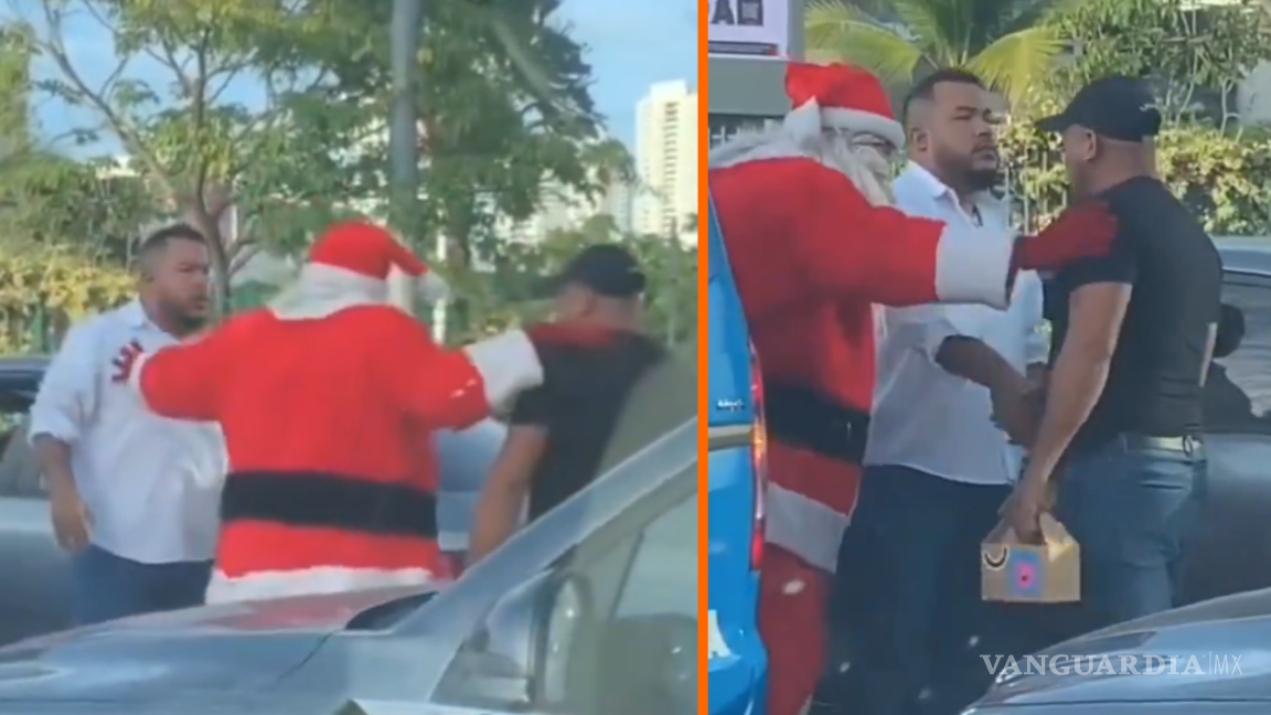 El Santa que resuelve... Captan momento en que Santa Claus detiene discusión entre dos hombres con regalos y un abrazo