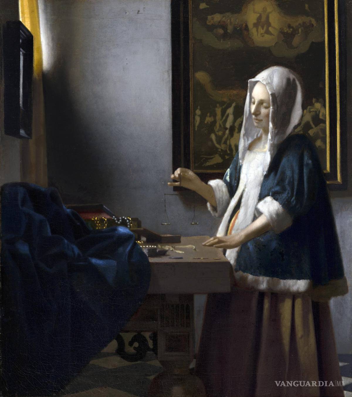 $!La obra Woman holding a balance (Mujer sosteniendo una balanza) atribuida al pintor neerlandés Johannes Vermeer y posiblemente pintada en 1664.