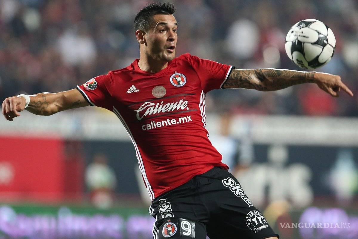 Xolos se aferran al liderato con mordida al Atlas