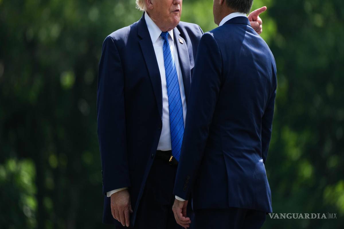$!El presidente Donald Trump (izq) con el director de la CIA John Ratcliffe en Camp David, cerca de Thurmont, Maryland, el 31 de julio del 2026.