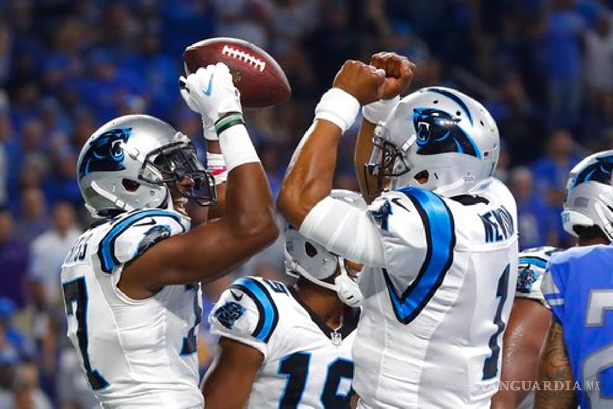 Cam Newton doma a los Lions en duelo de fieras