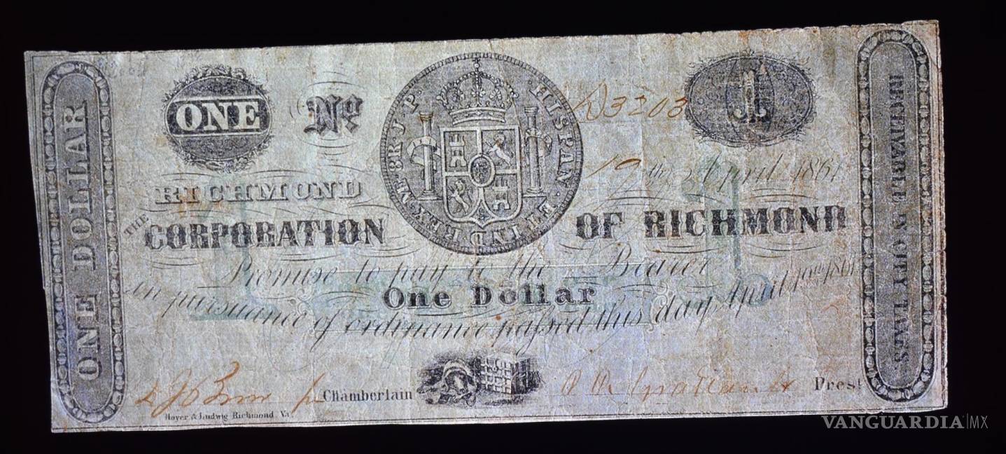 $!Dólar del año 1861 con el reverso del real de a ocho como sello de garantía, aunque la moneda hispana dejo de ser de curso legal desde el año 1857.