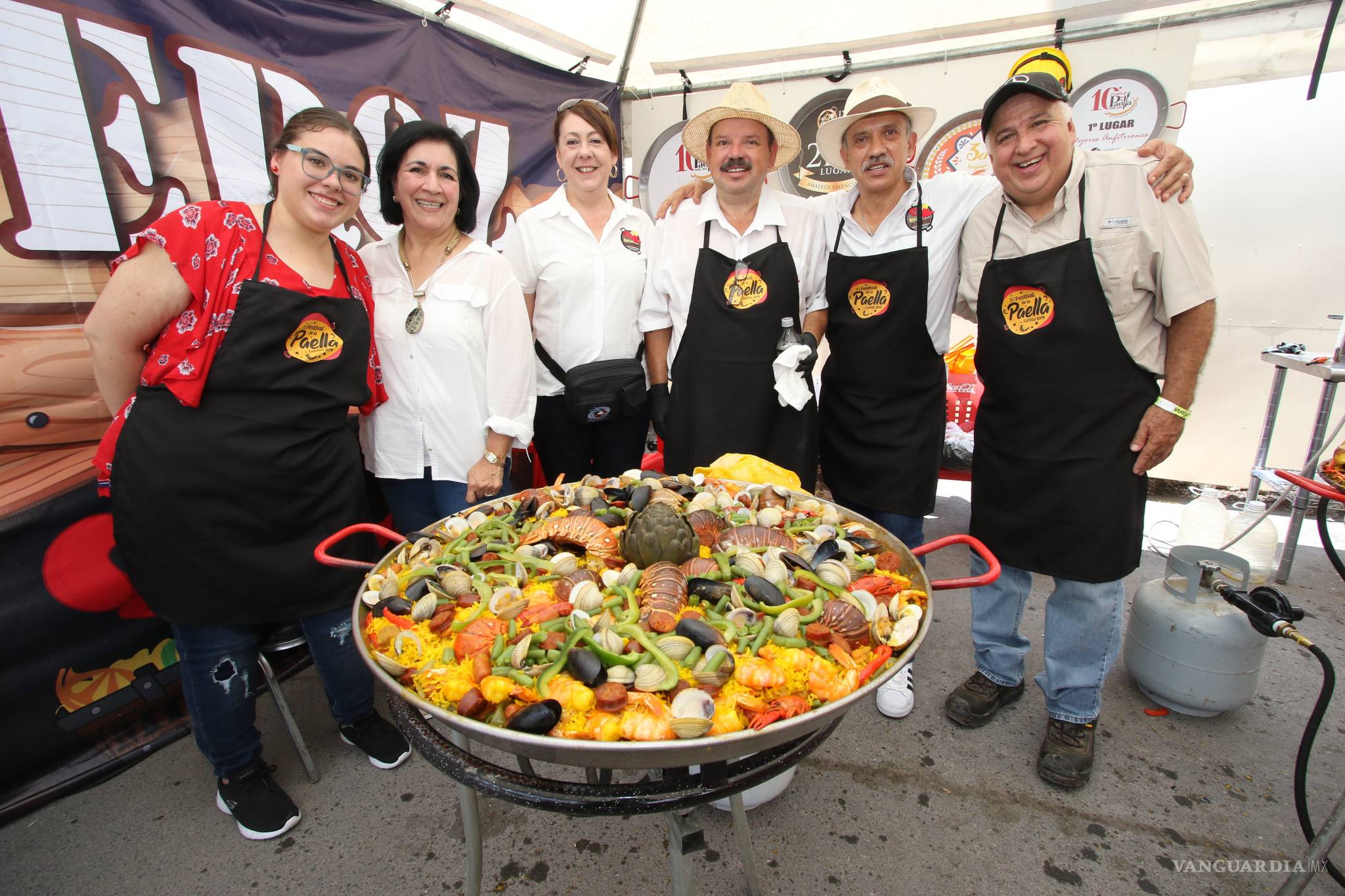 $!XI Festival de la Paella: sabores, amigos... y una tromba