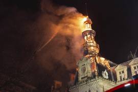 This photo provided by the Paris Fire Brigade (BSPP) shows the roof and the spire of the Paris 12th district town hall burning early Monday, Jan. 27, 2025 in Paris. (P Millet/BSPP via AP)