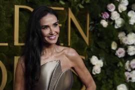 Demi Moore arrives at the 82nd Golden Globes on Sunday, Jan. 5, 2025, at the Beverly Hilton in Beverly Hills, Calif. (Photo by Jordan Strauss/Invision/AP)