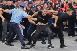 Protesters scuffle with police officers blocking a street during a demonstration in Tirana, Albania, Wednesday, June 3, 2026, opposing a luxury coastal development project linked to Jared Kushner and Ivanka Trump over concerns about environmental impacts and transparency.(AP Photo/Hameraldi Agolli)