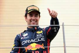 Red Bull driver Sergio Perez of Mexico smiles on the podium after finishing third in the Formula One Austrian Grand Prix auto race, at the Red Bull Ring racetrack, in Spielberg, Austria, Sunday, July 2, 2023. (AP Photo/Darko Vojinovic)