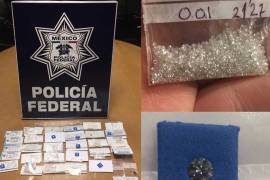 Detienen a español en el AICM con once mil 500 diamantes