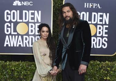 FILE - Lisa Bonet, left, and Jason Momoa arrive at the 77th annual Golden Globe Awards at the Beverly Hilton Hotel on Sunday, Jan. 5, 2020, in Beverly Hills, Calif. The couple have ended their 16-year relationship. A joint statement posted on the “Aquaman” star’s Instagram page Wednesday, Jan. 12, 2022, said that Momoa and his wife were parting ways. (Photo by Jordan Strauss/Invision/AP, file)