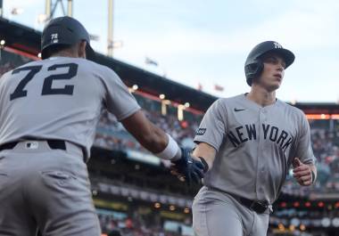New York Yankees' Ben Rice, right, is congratulated by José Caballero (72) after scoring against the San Francisco Giants during the fifth inning of a baseball game in San Francisco, Wednesday, March 25, 2026. (AP Photo/Jeff Chiu)