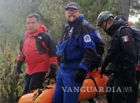 $!El cuerpo de la mujer fue traslado esta mañana a la parte baja de la montaña, donde iniciaron las investigaciones correspondientes.