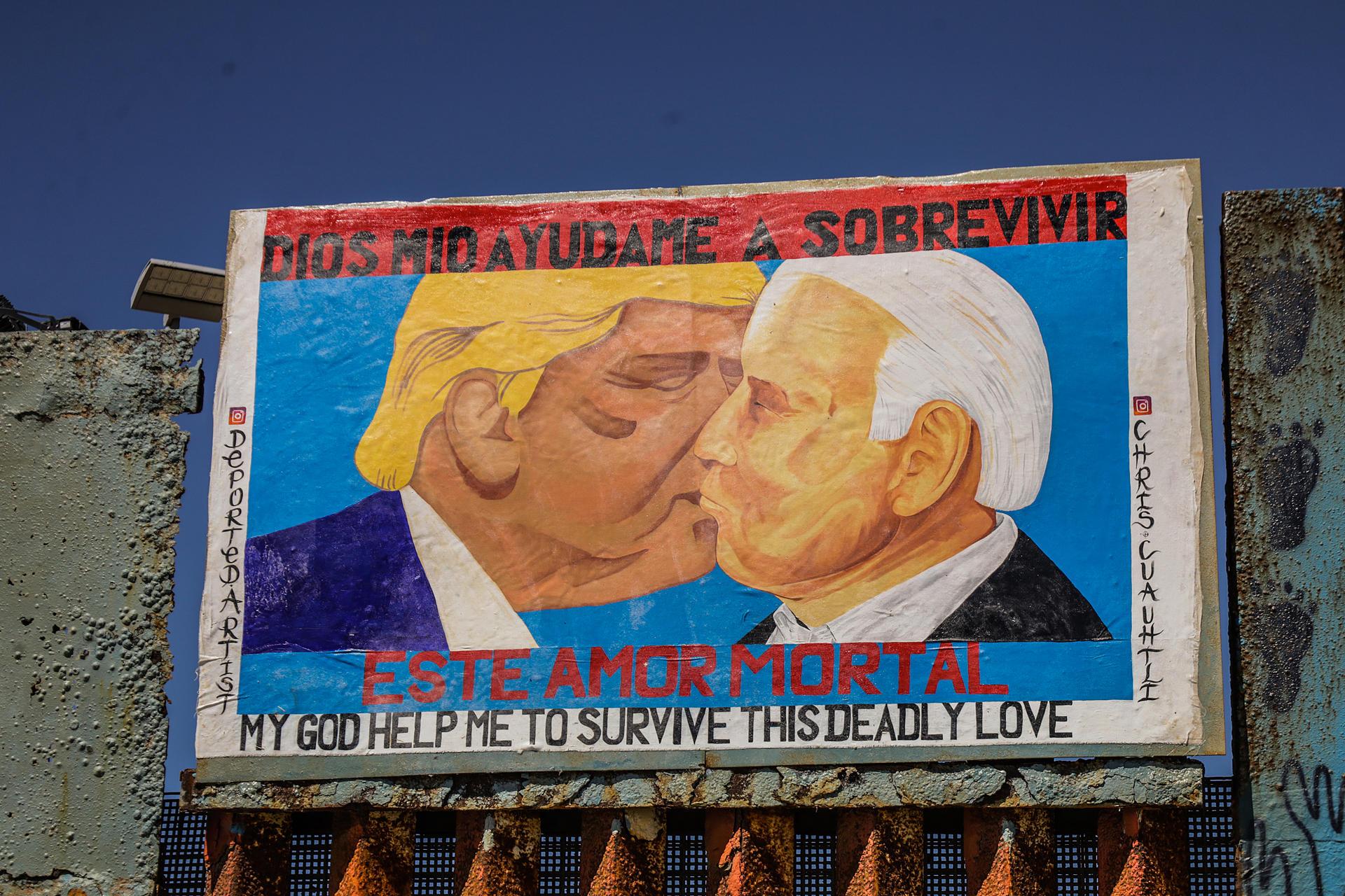 Un mural plasmado en un muro fronterizo en Tijuana muestra a Joe Biden y Donald Trump besándose. Noticias en tiempo real