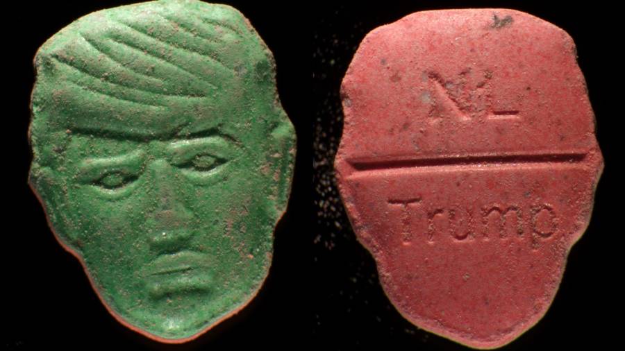 Pastillas que llevan la imagen del presidente estadounidense Donald Trump en una cara y, en la otra, las inscripciones “NL” y “Trump” grabadas en la superficie.