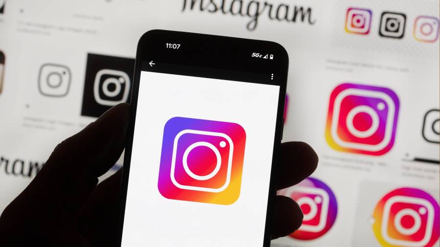 FILE - The Instagram logo is seen on a cell phone in Boston, Oct. 14, 2022. (AP Photo/Michael Dwyer, File)