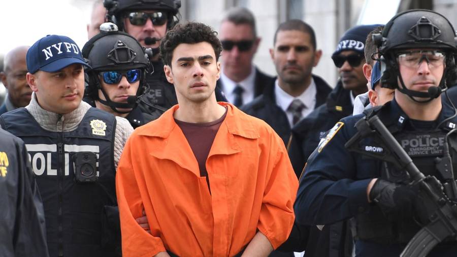 FILE - Luigi Mangione, a suspect in the fatal shooting of UnitedHealthcare CEO Brian Thompson, is escorted by police, Thursday, Dec. 19, 2024, in New York. (AP Photo/Pamela Smith, File)