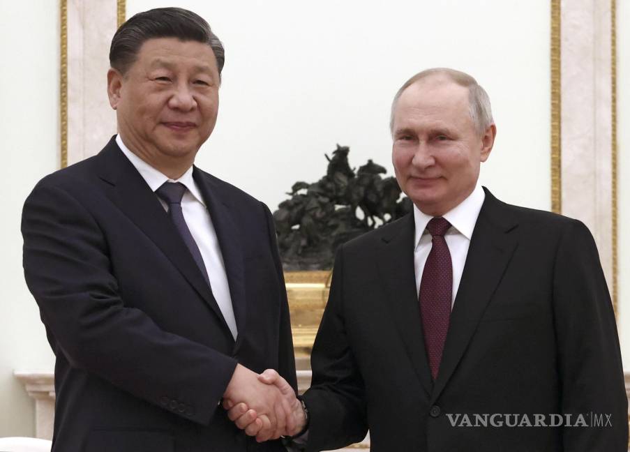 $!Saludo entre Xi y Putin.