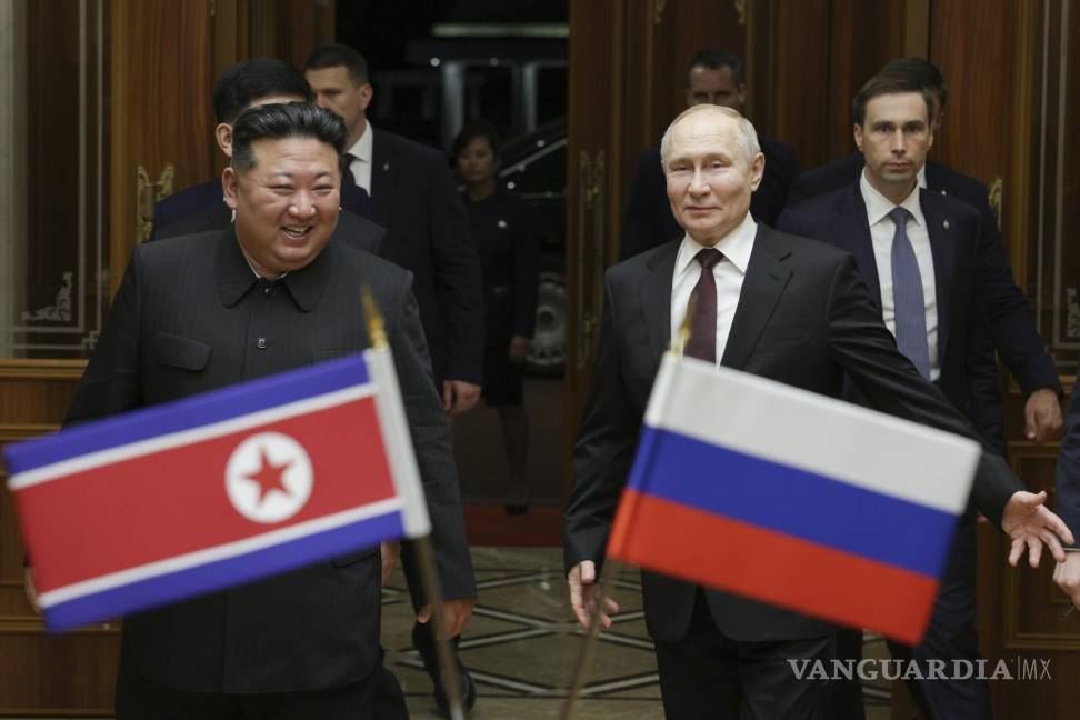 $!FILE - Russian President Vladimir Putin, right, and North Korea's leader Kim Jong Un smile during their meeting at the Pyongyang Sunan International Airport outside Pyongyang, North Korea, on June 19, 2024. (Gavriil Grigorov, Sputnik, Kremlin Pool Photo via AP, File)