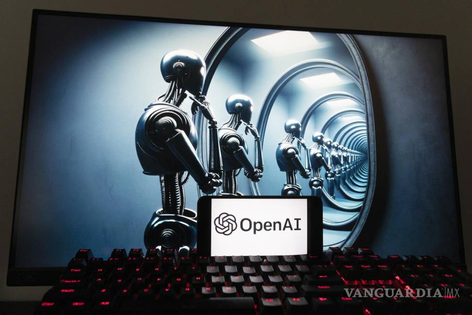 $!El logotipo de OpenAI se ve en un teléfono celular con una imagen en la pantalla de una computadora generada por el modelo de texto a imagen Dall-E de ChatGPT.